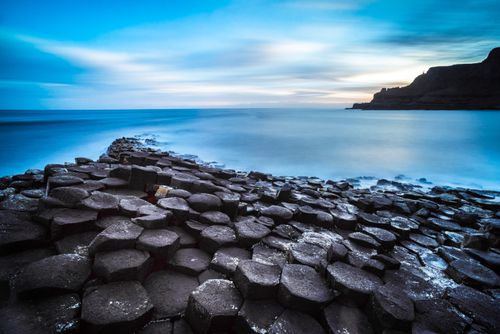 Landscape Photography by Professional Freelance UK Landscape Photographer Giants Causeway and its hexagonal basalt rocks with a dramatic sunrise on the Antrim Coast Northern Ireland