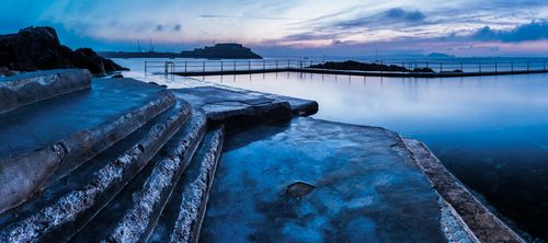 Landscape Photography by Professional Freelance UK Landscape Photographer Guernsey Bathing Pools and Castle Cornet at sunrise Channel Islands United Kingdom