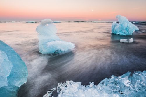 Landscape Photography by Professional Freelance UK Landscape Photographer Icebergs at sunset on Jokulsarlon Beach a black volcaic sand beach in South East Iceland