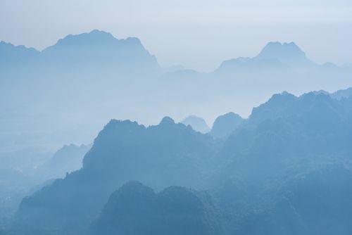 Landscape Photography by Professional Freelance UK Landscape Photographer Misty limestone karst mountain landscape at sunrise seen from Mount Zwegabin Hpa An Kayin State Karen State Myanmar Burma