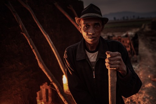 Madagascar Wildlife Photography Holiday Brick workers firing a kiln near Antsirabe Vakinankaratra Region Madagascar