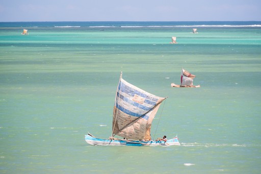 Madagascar Wildlife Photography Holiday Fisherman fishing from a Pirogue a traditional Madagascar sailing boat Ifaty Madagascar Africa