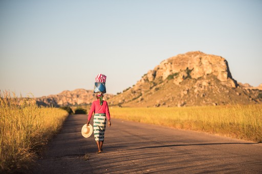 Madagascar Wildlife Photography Holiday Local Madagascan Woman balancing goods on her head Isalo National Park Southwest Madagascar