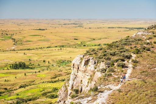 Madagascar Wildlife Photography Holiday Tourist walking in Isalo National Park with Ihorombe Plains behind Southwest Madagascar